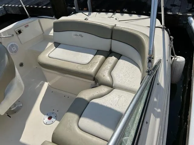 Slide: The Image of 2006 Sea Ray 200 Sundeck boat interior with cushioned seating. - 10