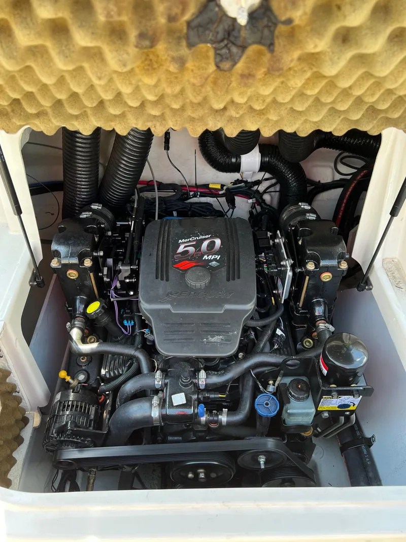 Slide: The Image of 2006 Sea Ray 200 Sundeck engine compartment with MerCruiser motor, detailed view. - 2