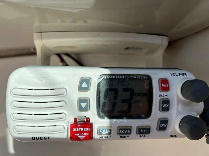 Slide: The Image of Marine radio on a 2006 Sea Ray 200 Sundeck, displaying channel 73. - 3