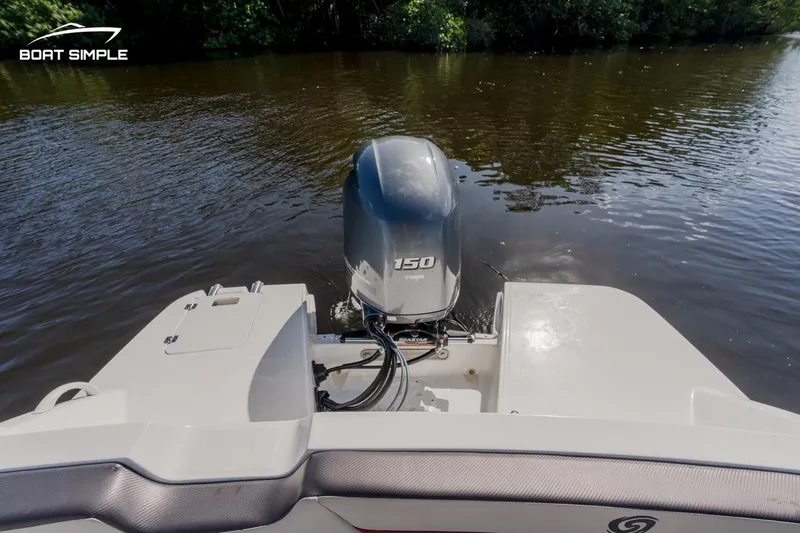 Slide: The Image of 2023 Hurricane SunDeck Sport 205 OB boat with 150 HP outboard motor on calm water. - 5