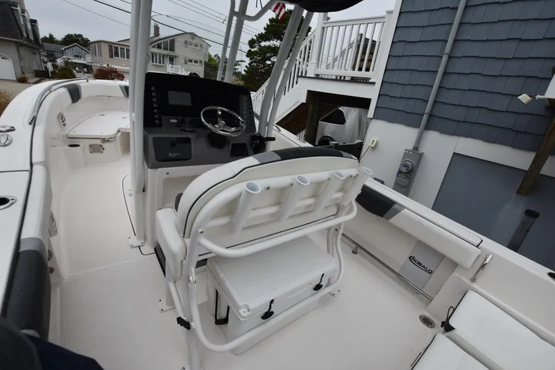 Slide: The Image of 2023 Robalo R230 Center Console boat interior with helm and seating. - 30