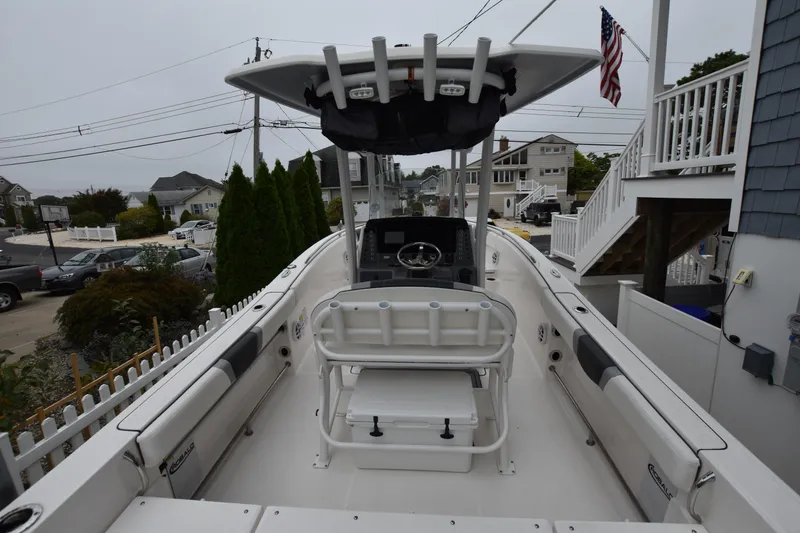 Slide: The Image of 2023 Robalo R230 Center Console boat docked in a residential area. - 31