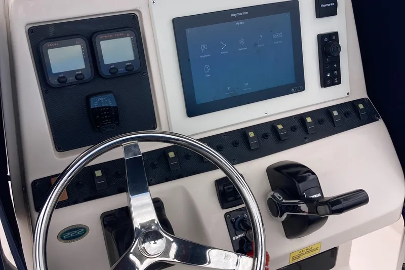 Slide: The Image of Control panel of 2006 Grady-White 222 Fisherman boat with steering wheel and navigation display. - 10
