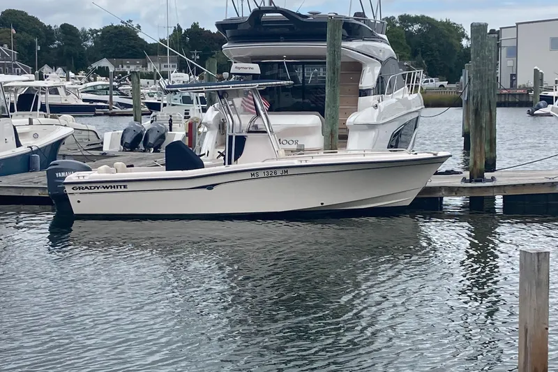 Slide: The Image of 2006 Grady-White 222 Fisherman boat docked in a marina. - 7