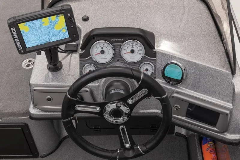 Slide: The Image of 2024 Nitro ZV20 boat dashboard with steering wheel and navigation display. - 12