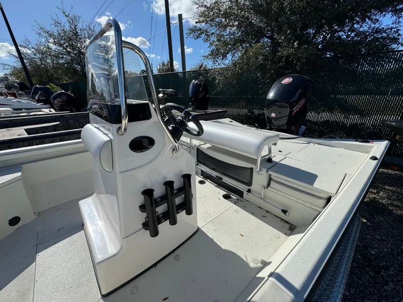 Slide: The Image of 2024 Ranger RB200 boat interior with steering console and rod holders. - 4