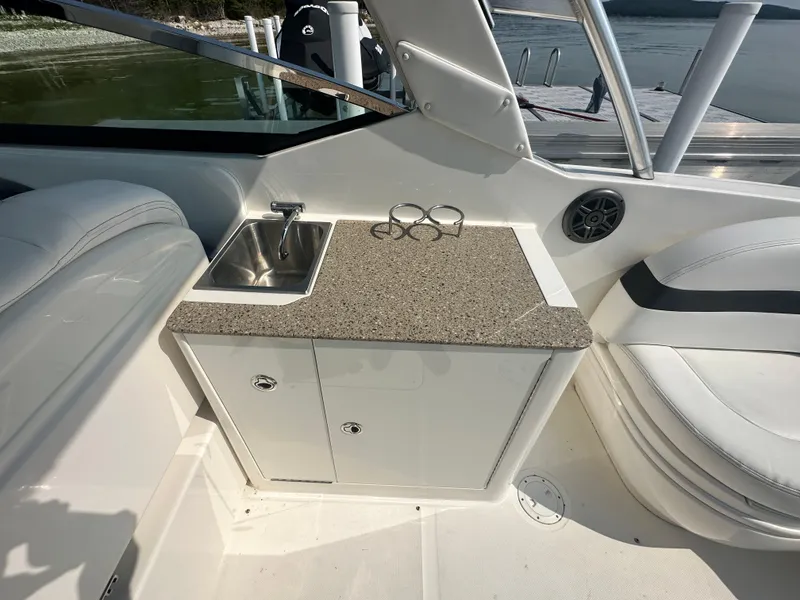 Slide: The Image of Interior view of 2015 Sea Ray 300 SLX boat with sink and countertop. - 12