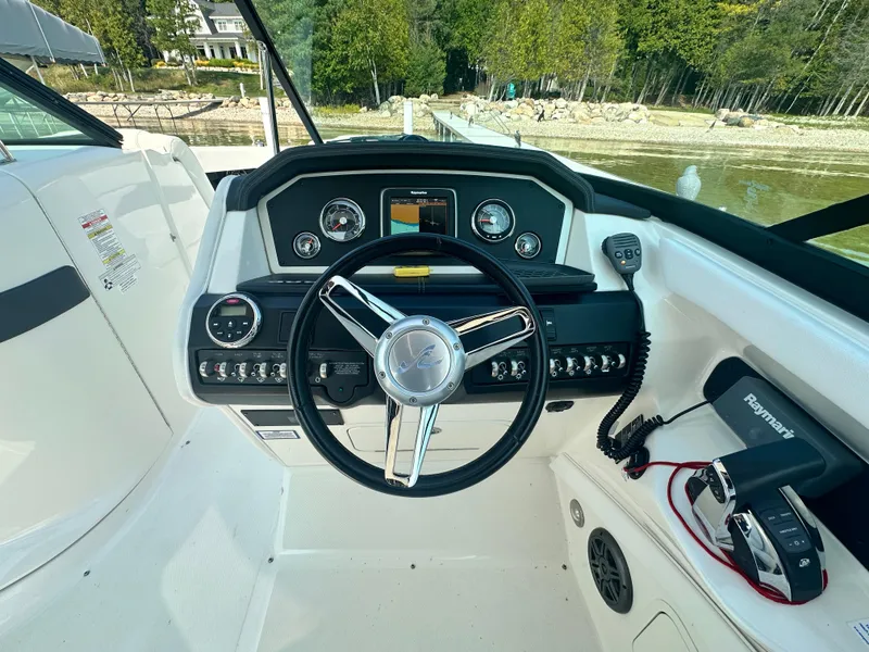 Slide: The Image of Steering wheel and dashboard of 2015 Sea Ray 300 SLX boat. - 17