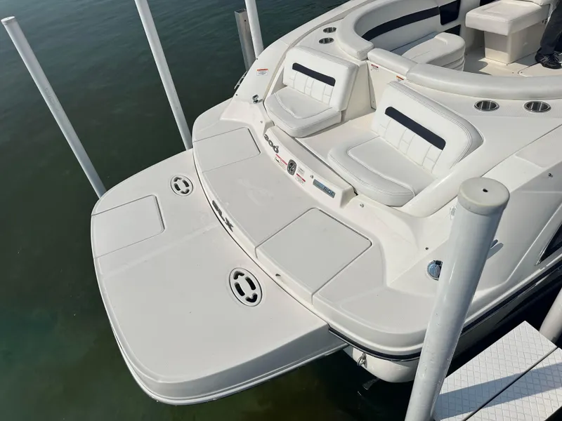 Slide: The Image of 2015 Sea Ray 300 SLX boat with spacious seating and swim platform. - 2
