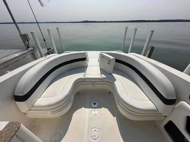Slide: The Image of 2015 Sea Ray 300 SLX boat with spacious seating overlooking calm waters. - 22