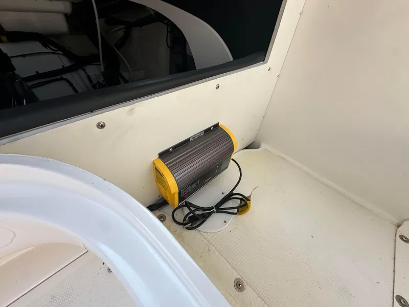 Slide: The Image of 2015 Sea Ray 300 SLX interior with a portable heater on the floor. - 27