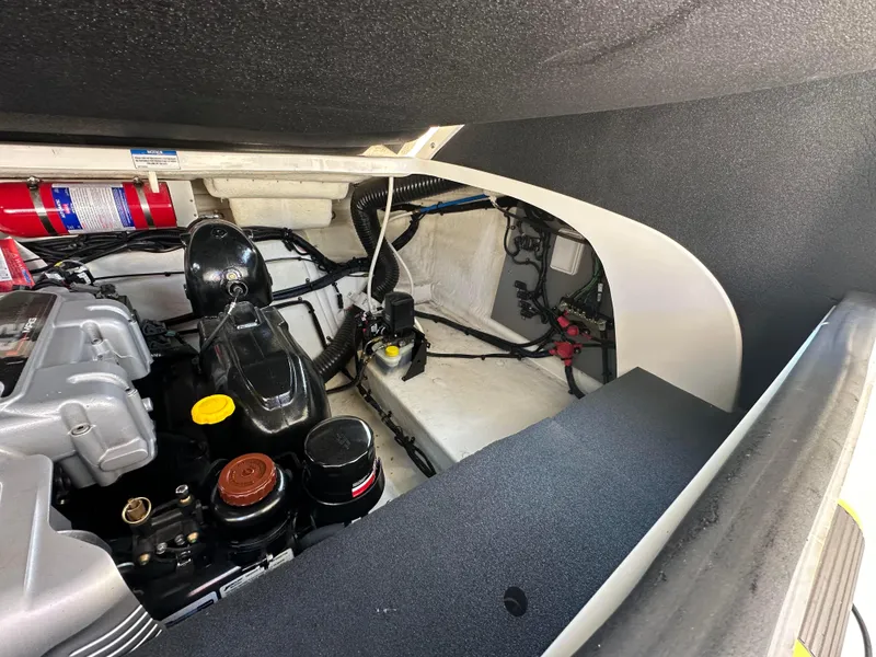 Slide: The Image of Engine compartment of a 2015 Sea Ray 300 SLX boat, showcasing mechanical components. - 28