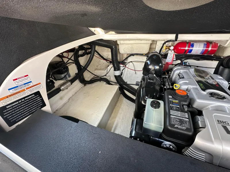 Slide: The Image of Engine compartment of a 2015 Sea Ray 300 SLX boat with visible fire extinguisher. - 29