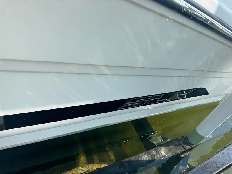 Slide: The Image of 2015 Sea Ray 300 SLX boat hull with water reflection. - 4