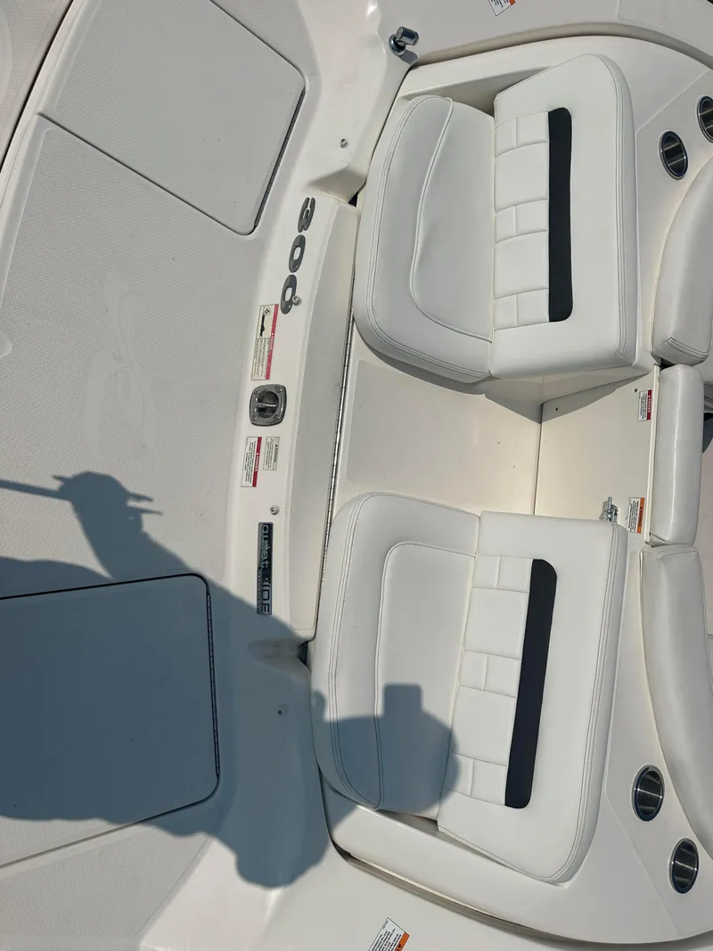 Slide: The Image of 2015 Sea Ray 300 SLX boat interior with white seating and sleek design. - 9