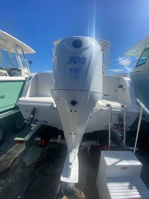 Slide: The Image of 2025 Sailfish 245 DC boat with powerful 300 HP outboard motor. - 12