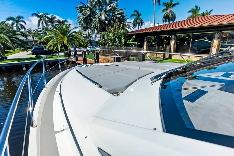 Slide: The Image of 2013 Absolute 55 FLY yacht docked near tropical waterfront home. - 22