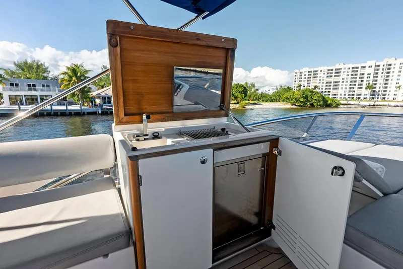 Slide: The Image of Outdoor kitchenette on 2013 Absolute 55 FLY yacht with scenic waterfront view. - 33