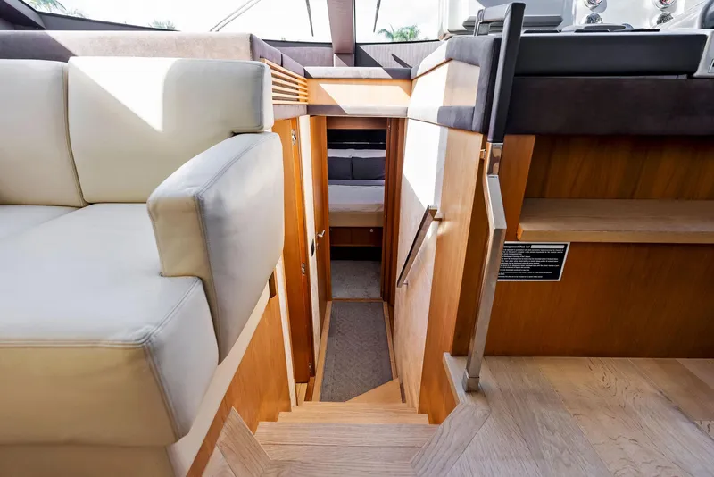 Slide: The Image of Interior view of 2013 Absolute 55 FLY yacht with wooden stairs and seating area. - 35