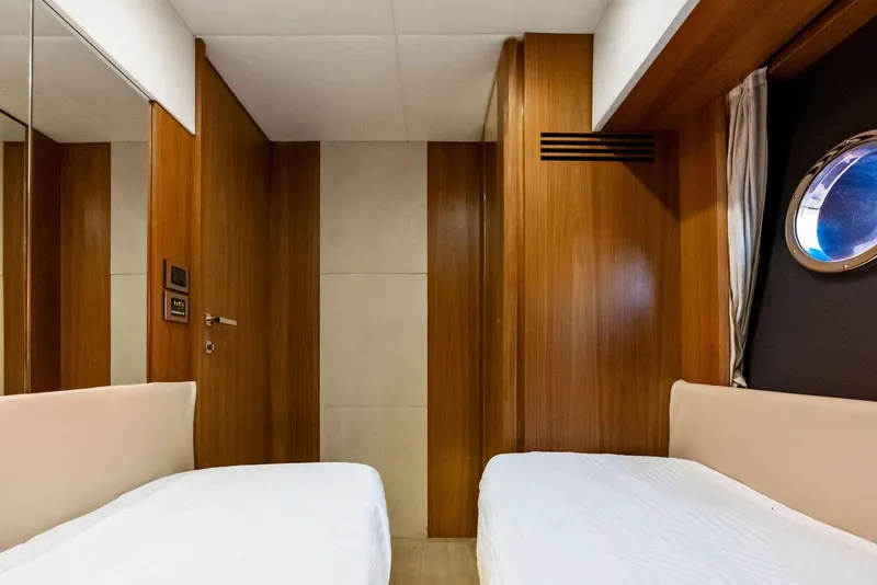 Slide: The Image of Luxurious cabin interior of 2013 Absolute 55 FLY yacht with twin beds and wooden accents. - 38