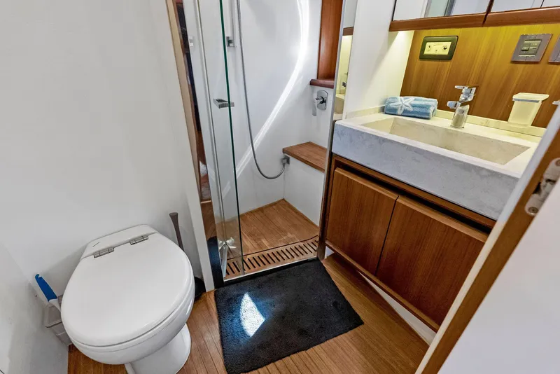 Slide: The Image of Luxurious bathroom on 2013 Absolute 55 FLY yacht with modern fixtures and wooden accents. - 40