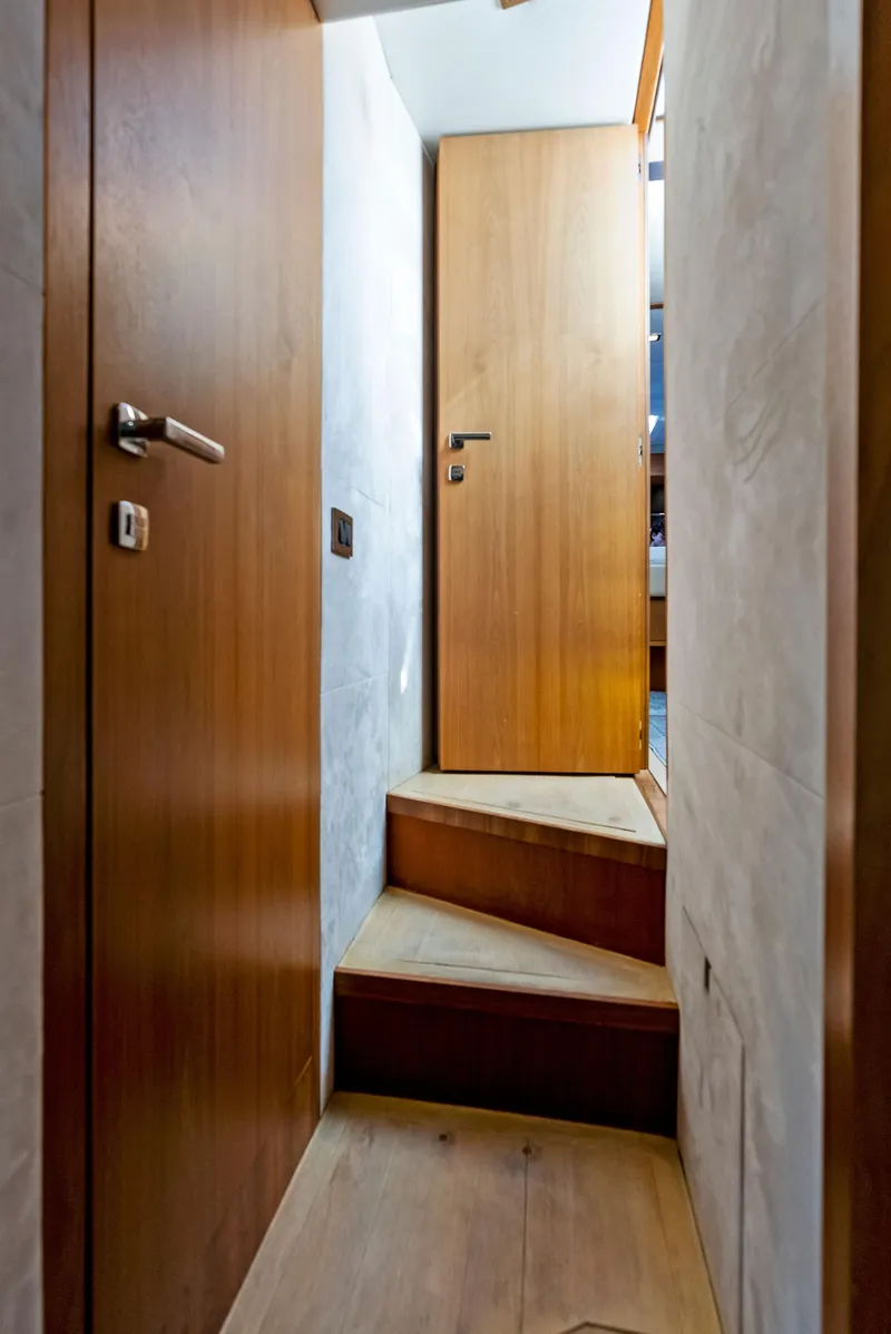 Slide: The Image of Wooden staircase and doors inside 2013 Absolute 55 FLY yacht. - 43