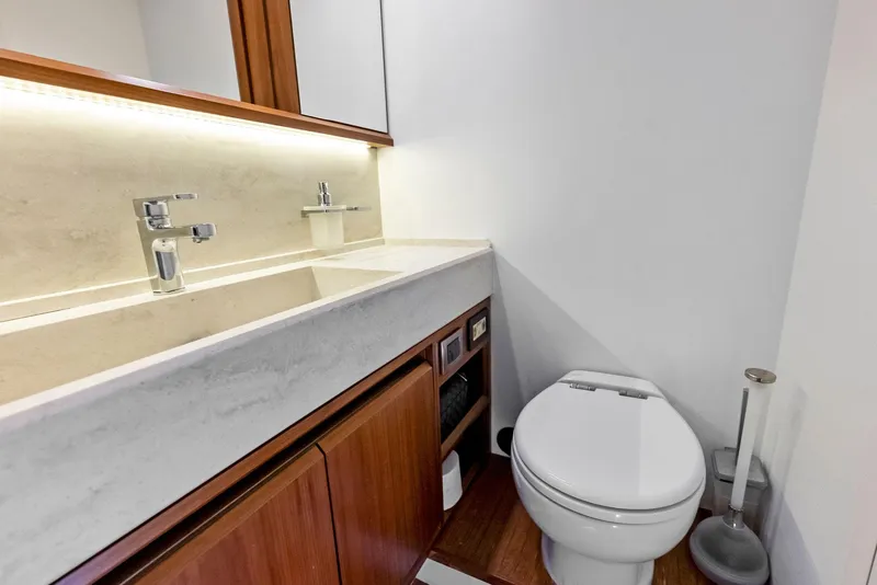 Slide: The Image of Luxurious bathroom in 2013 Absolute 55 FLY yacht with modern fixtures and wooden cabinetry. - 45