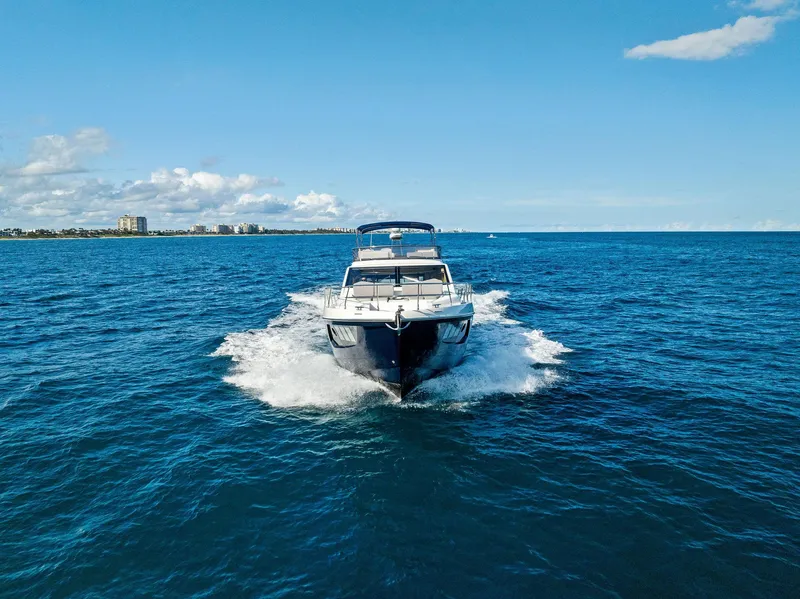 Slide: The Image of Aerial view of 2013 Absolute 55 FLY yacht cruising on blue ocean waters. - 9