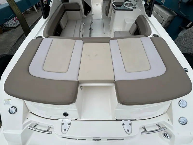 Slide: The Image of 2013 Sea Ray 270 SLX boat interior with beige and white seating. - 11