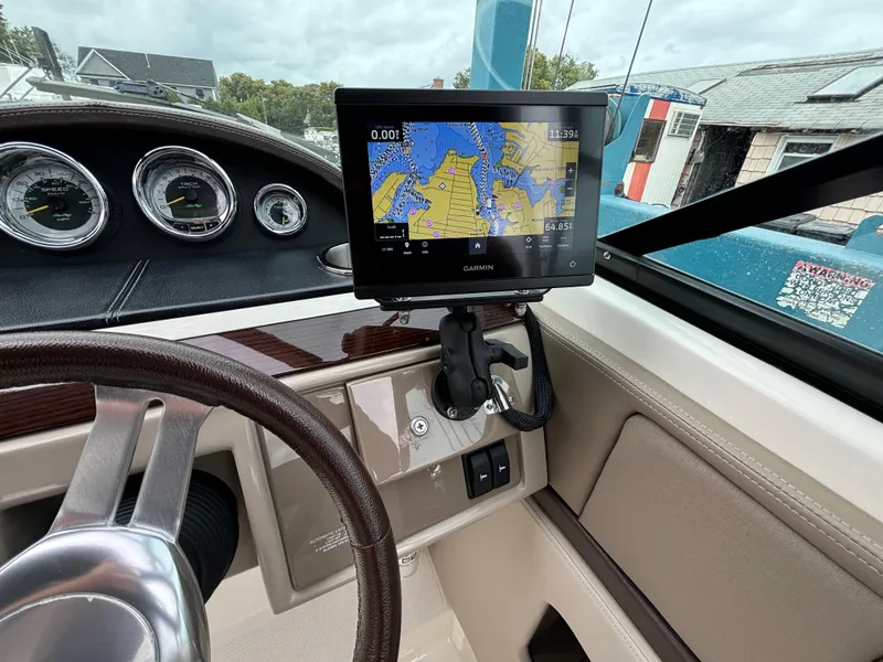 Slide: The Image of Dashboard of 2013 Sea Ray 270 SLX with Garmin navigation system and gauges. - 14
