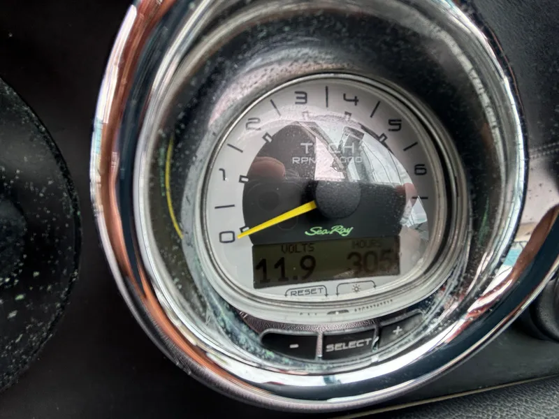 Slide: The Image of Close-up of 2013 Sea Ray 270 SLX tachometer displaying RPM and voltage readings. - 17
