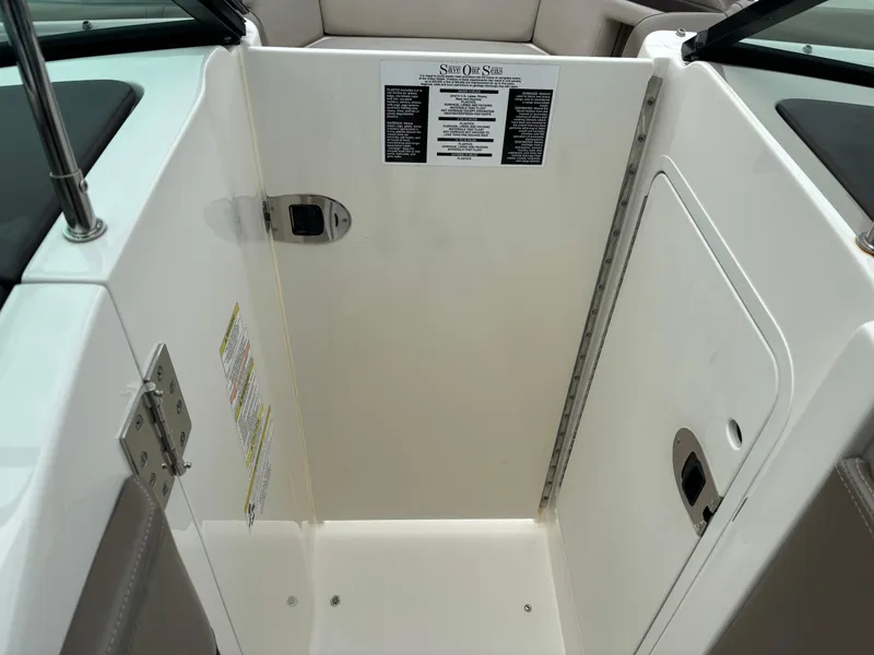 Slide: The Image of Interior view of 2013 Sea Ray 270 SLX boat compartment with safety instructions. - 21