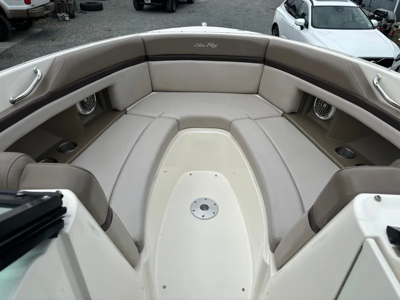Slide: The Image of 2013 Sea Ray 270 SLX boat interior with beige seating and cup holders. - 23
