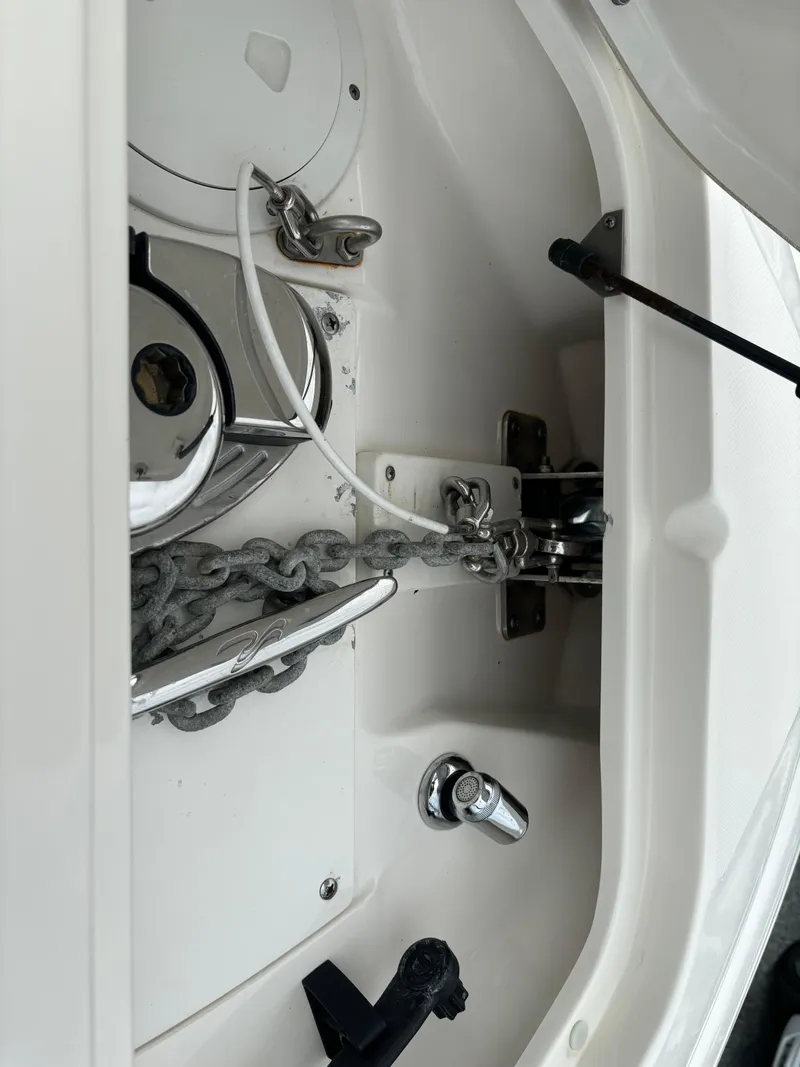Slide: The Image of Anchor compartment of 2013 Sea Ray 270 SLX boat, featuring chain and winch. - 24