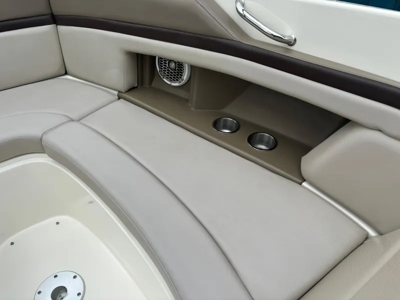 Slide: The Image of Interior seating of 2013 Sea Ray 270 SLX boat with cup holders and speaker. - 28