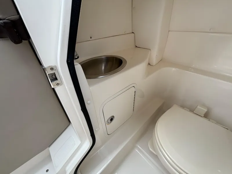 Slide: The Image of 2013 Sea Ray 270 SLX boat bathroom with sink and toilet. - 30