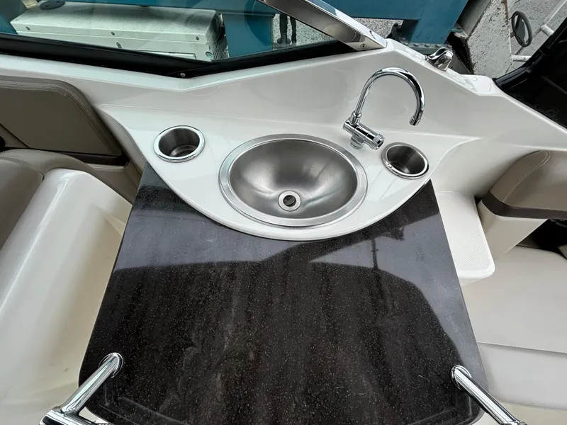 Slide: The Image of 2013 Sea Ray 270 SLX boat interior with sink and countertop. - 31
