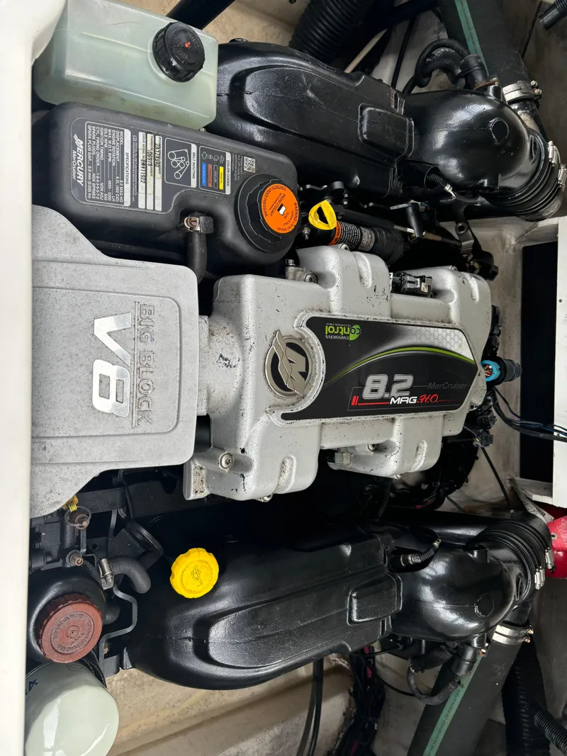 Slide: The Image of 2013 Sea Ray 270 SLX boat engine, featuring a powerful 8.2L V8 motor. - 33