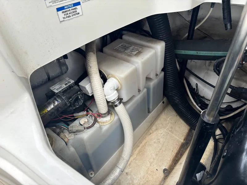 Slide: The Image of Engine compartment of a 2013 Sea Ray 270 SLX boat, showing hoses and components. - 34