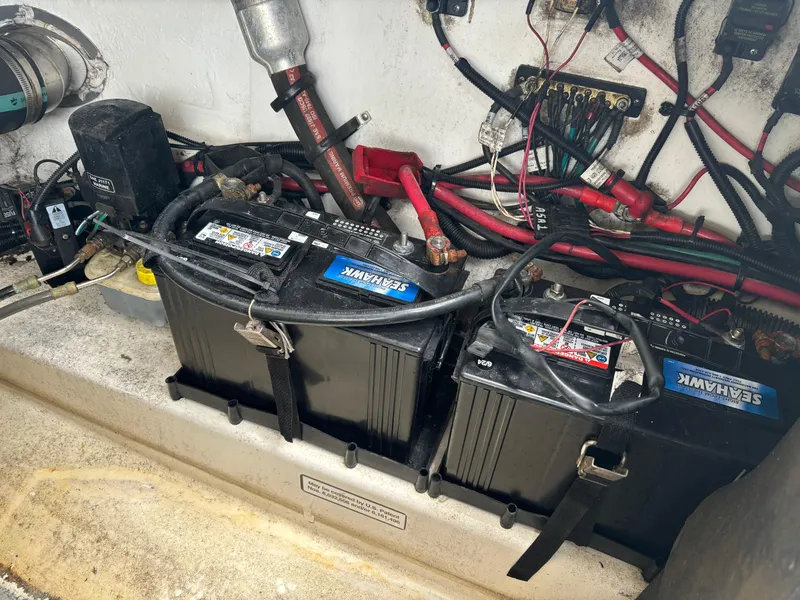 Slide: The Image of Batteries and wiring in a 2013 Sea Ray 270 SLX boat engine compartment. - 36