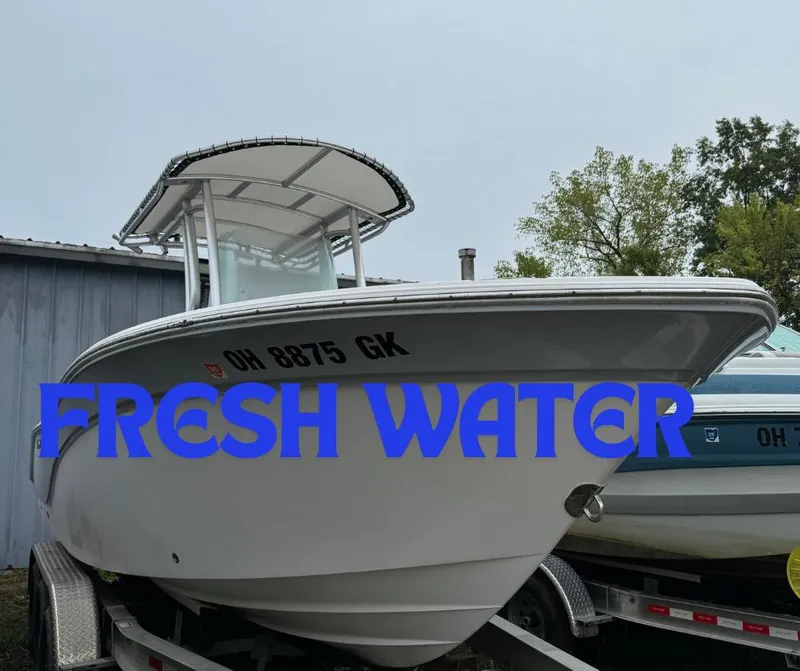 Slide: The Image of 2023 Sea Fox 228 Commander boat on trailer, labeled "FRESH WATER." - 0