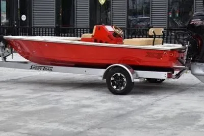 Slide: The Image of Red 2023 ZCB Curlew 18 boat on trailer, parked outdoors. - 4