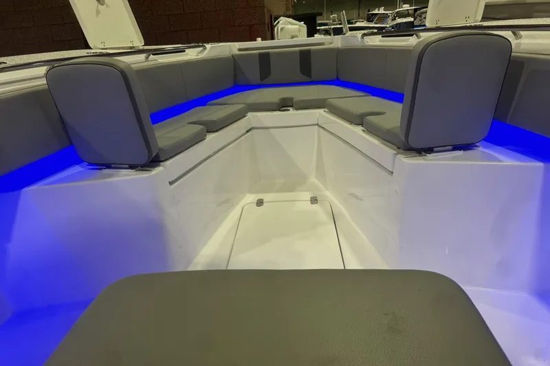 Slide: The Image of 2023 Cape Horn 34 XS boat interior with blue LED lighting and gray seating. - 10