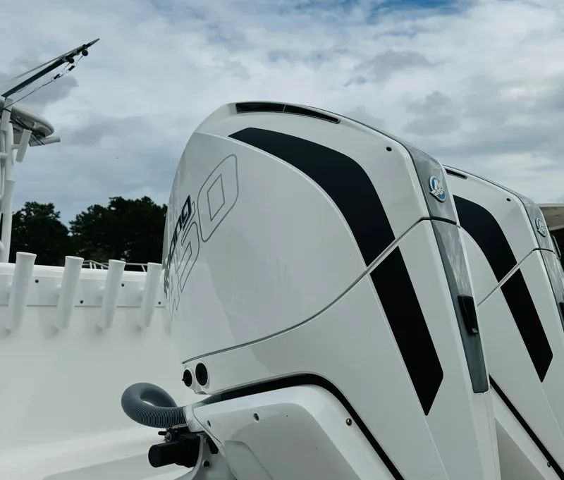 Slide: The Image of 2023 Cape Horn 34 XS boat with dual outboard engines under cloudy sky. - 19