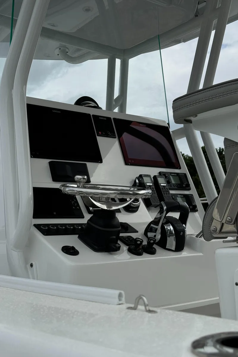 Slide: The Image of 2023 Cape Horn 34 XS boat console with advanced navigation and control systems. - 21