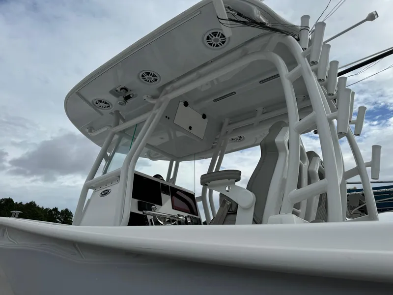 Slide: The Image of 2023 Cape Horn 34 XS boat, sleek design, modern console, overcast sky. - 22