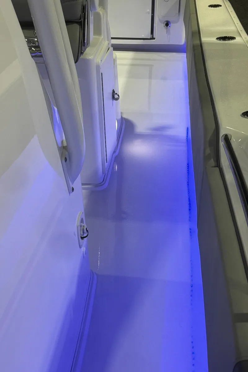 Slide: The Image of 2023 Cape Horn 34 XS boat interior with blue LED lighting. - 12