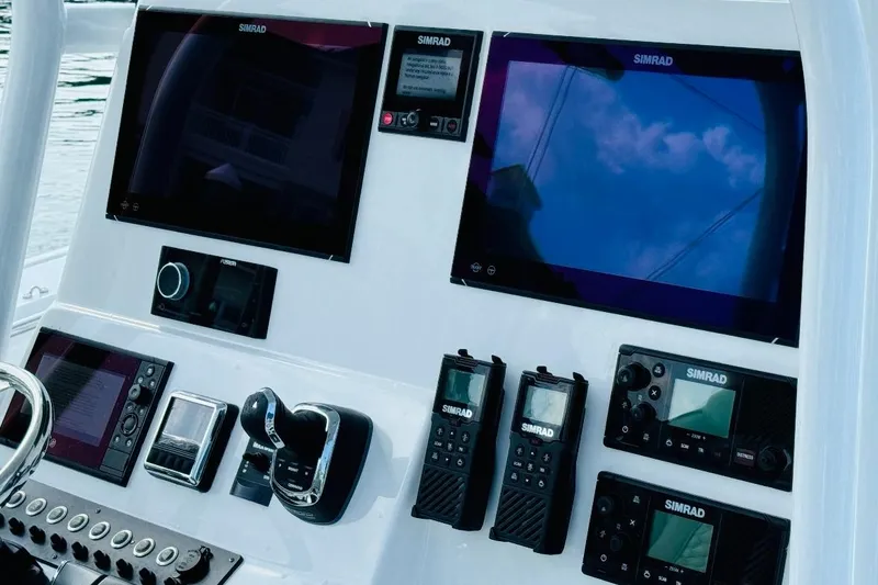 Slide: The Image of 2023 Cape Horn 34 XS boat dashboard with advanced navigation equipment. - 4