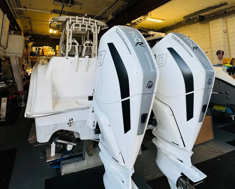 Slide: The Image of 2023 Cape Horn 34 XS boat with dual powerful outboard engines in a garage. - 5