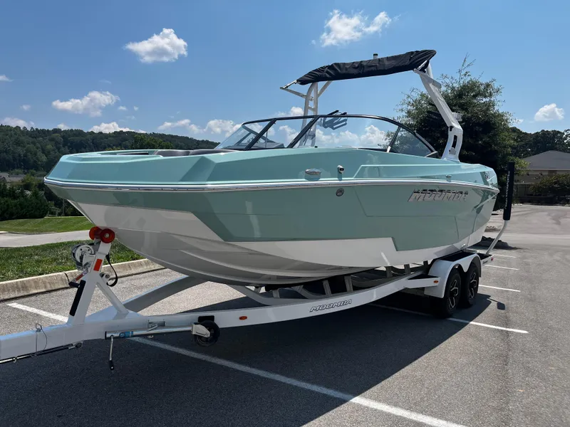 The Image of 2025 Moomba Max boat on trailer in sunny parking lot. - 0